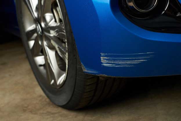 Zoomed view of a front bumper car scuff